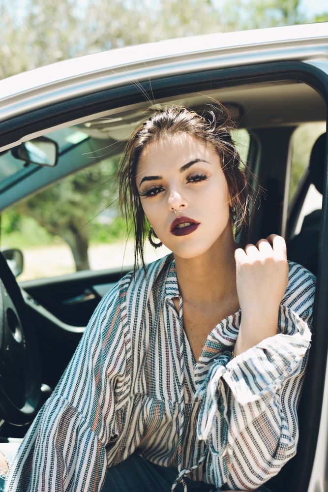 Portrait of woman sitting in the car's.