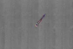 Conceptual aerial photo of a young woman with colorful shadow