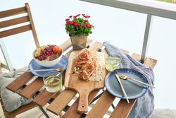 Appetizing breakfast on table on terrace