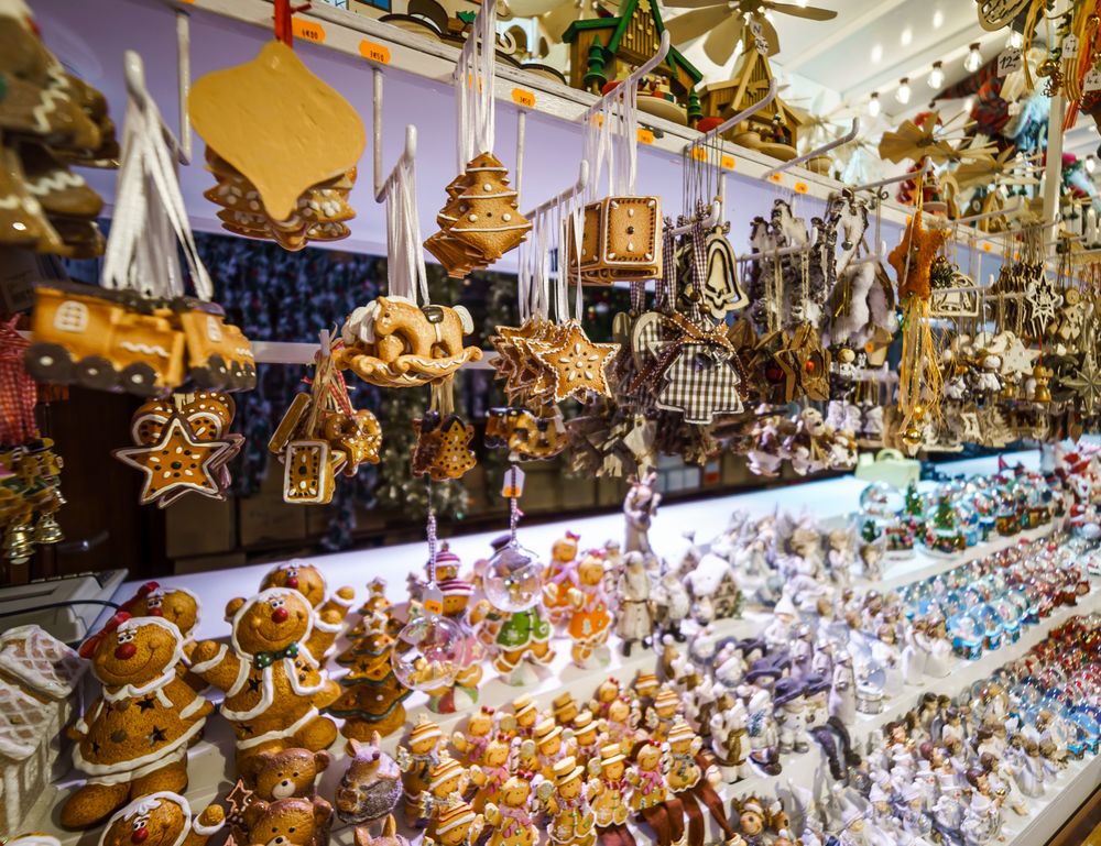 Traditional Christmas market with handmade souvenirs on shelves in shop