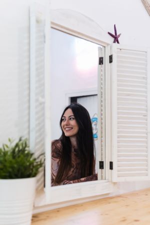 Smiling woman chilling in bar