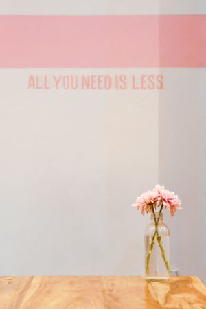Beautiful flowers in bottle with text on background