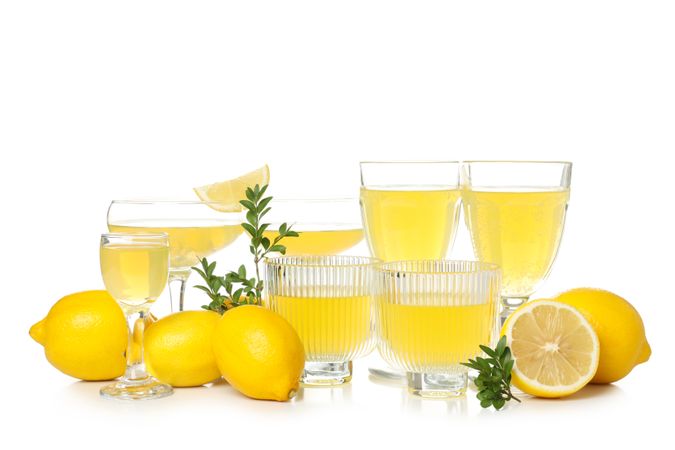 Limoncello, Italian lemon liqueur, isolated on light background