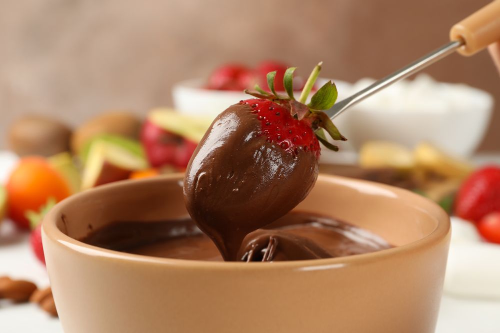 Strawberry in chocolate, close up. Chocolate fondue