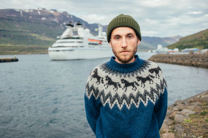 Portrait of Scandinavian man in the bay with cruise ship in background