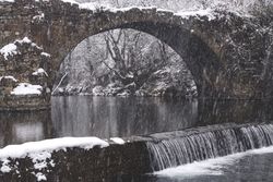 River streaming between snow forest