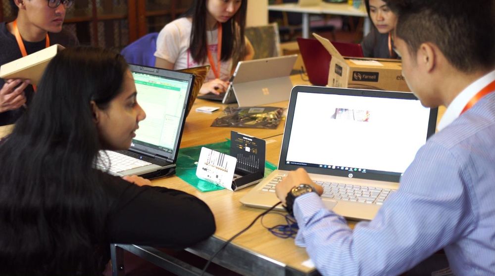 Group of young people learning gaming/software engineering