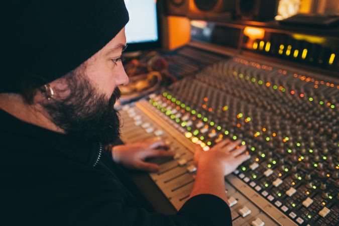Man in a equalizer instrument in a studio