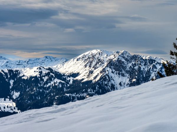 Swiss Alps winter landscape with snow and sun, mountains in Europe