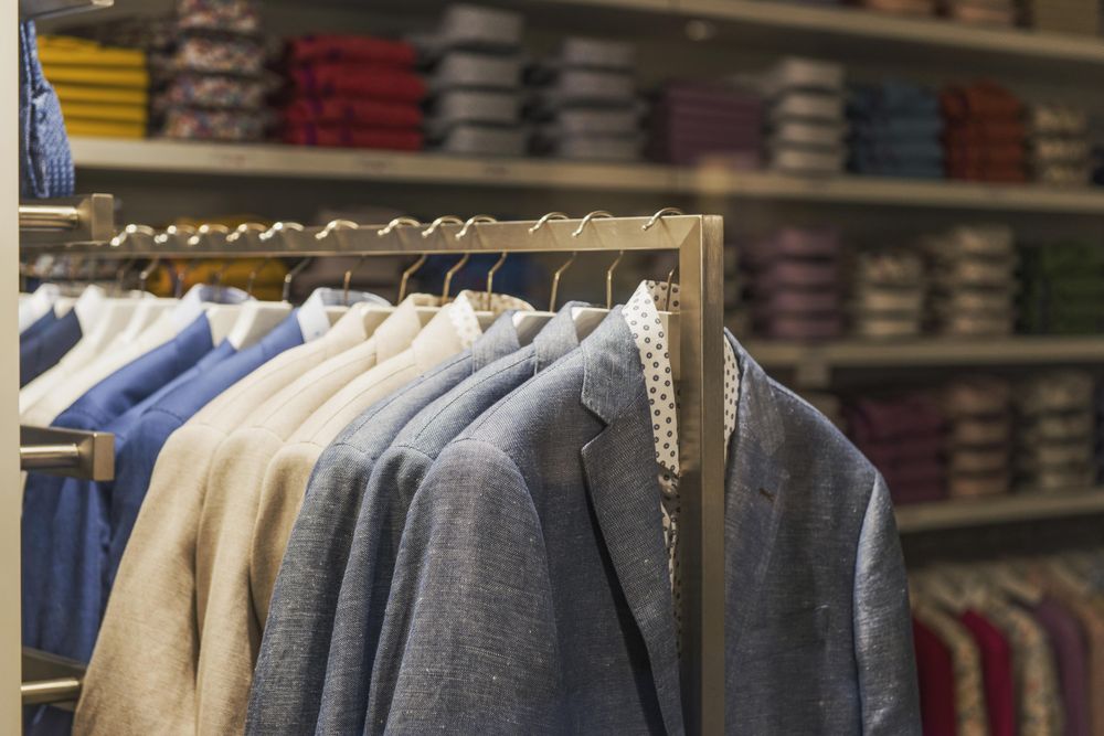 Rack of hanged blazers in fashion store