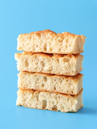 Focaccia bread slices minimalist on a blue background