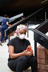 Two nurses outside of medical building on break