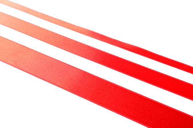 Red ribbons isolated on blank background. Gift concept