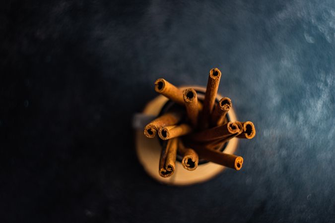 Top view of cinnamon sticks in container