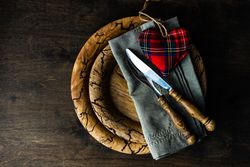 Valentine's day concept with silverware on plate with with napkin and tartan heart