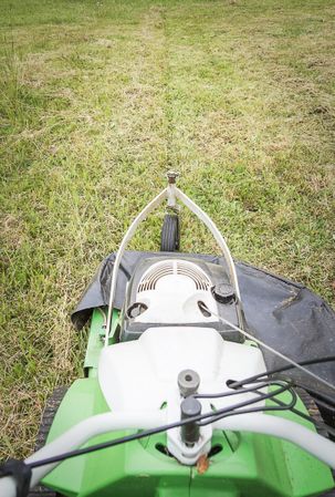 Top view of lawnmower in the garden ready to cut