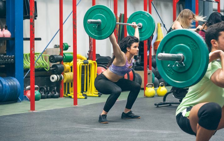 Woman practicing weightlifting in the gym