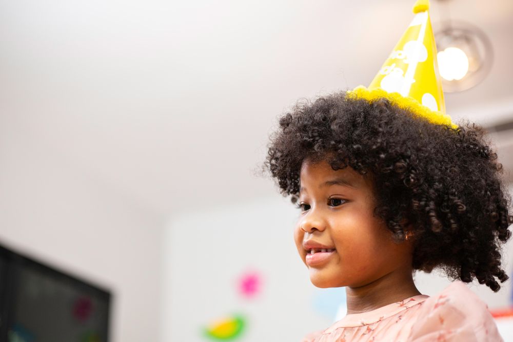 Smiling young girl at a party