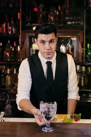 Barman working making drinks
