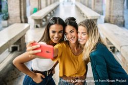 Three multi-ethnic women posing for selfie 4BK83b