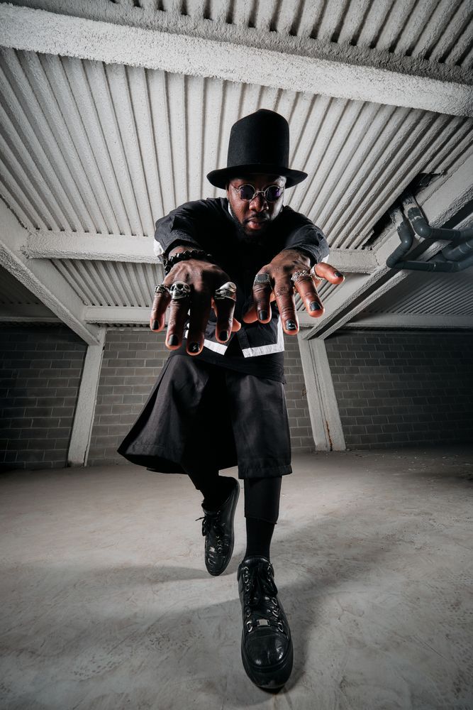 Extravagant Black man dancing in garage
