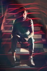 Man sitting on stairs in nightclub