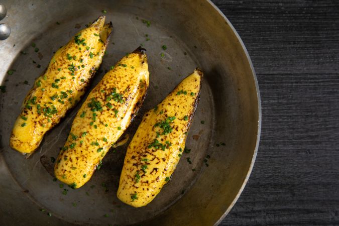 Endives with hollandaise sauce au gratin in pan on table