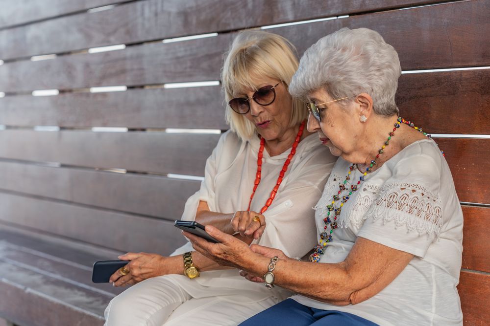 Female friends talking on bench
