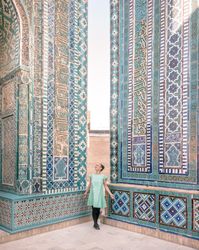 Unrecognizable tourist inside ancient building