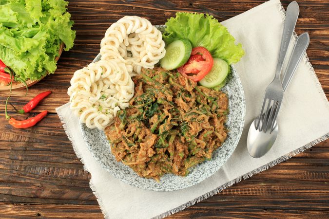 Top view of plate of lotek, Sudanese vegetable salad with peanut dressing