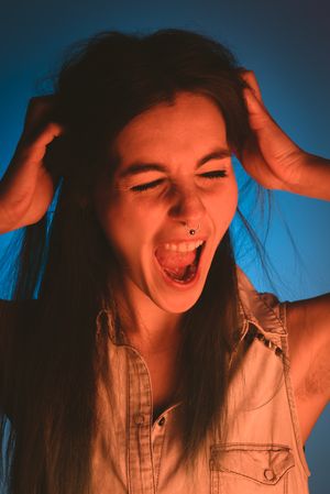 woman touching her hair