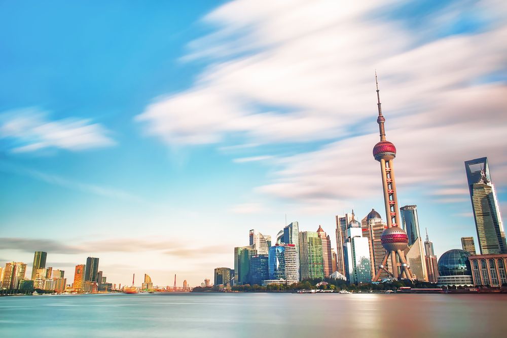 City skyline across body of water in Lujiazui, Pudong, Shanghai, China