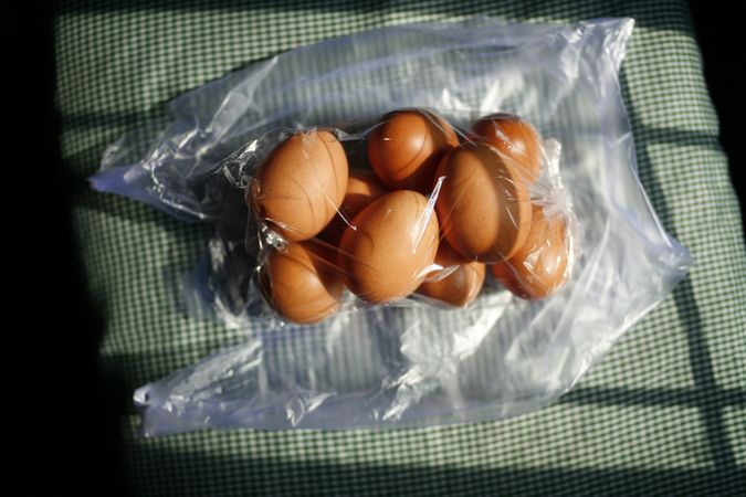 Top view of eggs in plastic bad