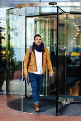 Trendy man walking out mall