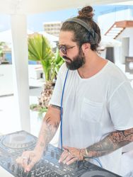 DJ playing music in hotel party area