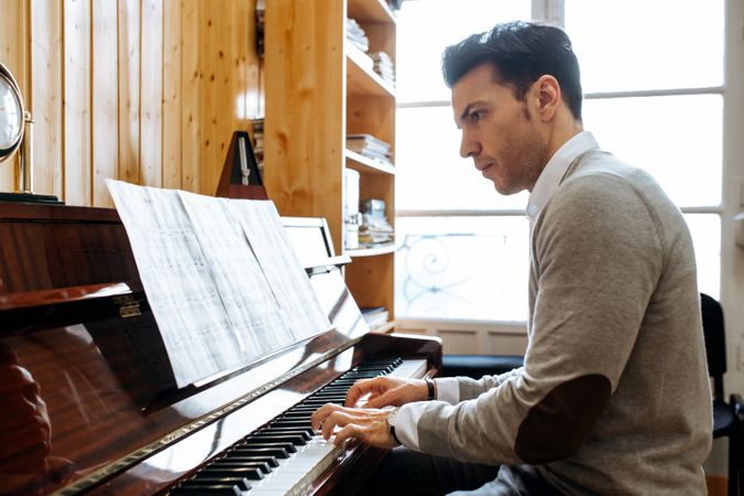 Man playing piano in studio