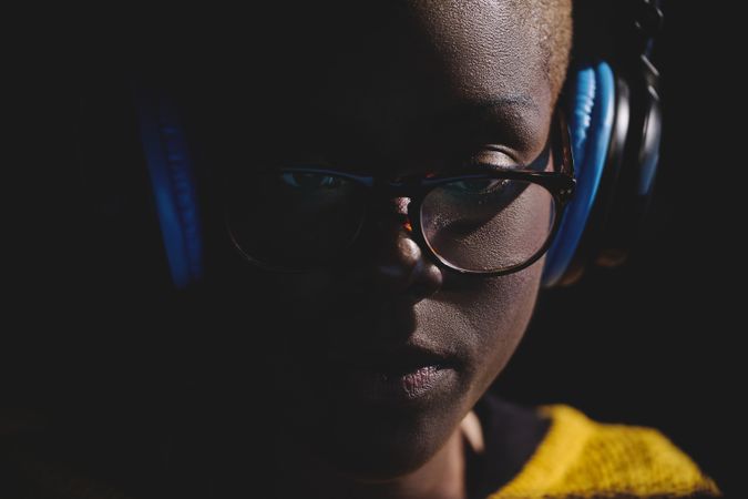 Serious Black woman in headphones