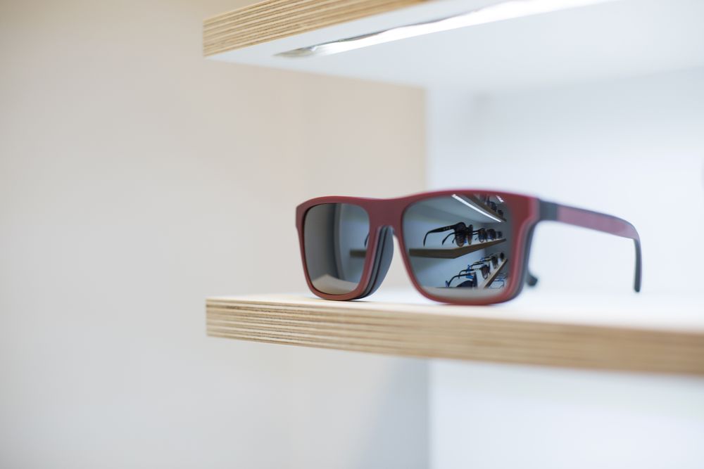 sunglasses on a shelf in a store