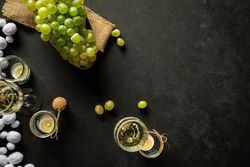 Glasses with wine and grapes