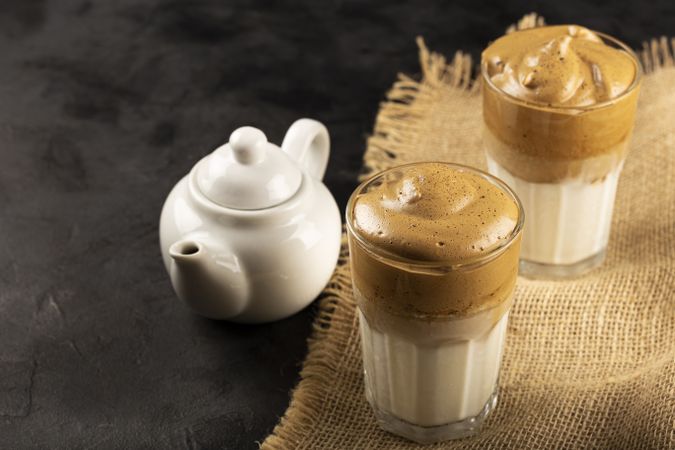 Iced Dalgona Coffee, glass with milk and coffee cream.