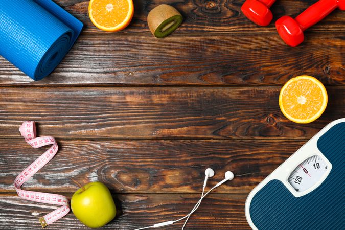 Flat lay composition with healthy lifestyle accessories on wooden background