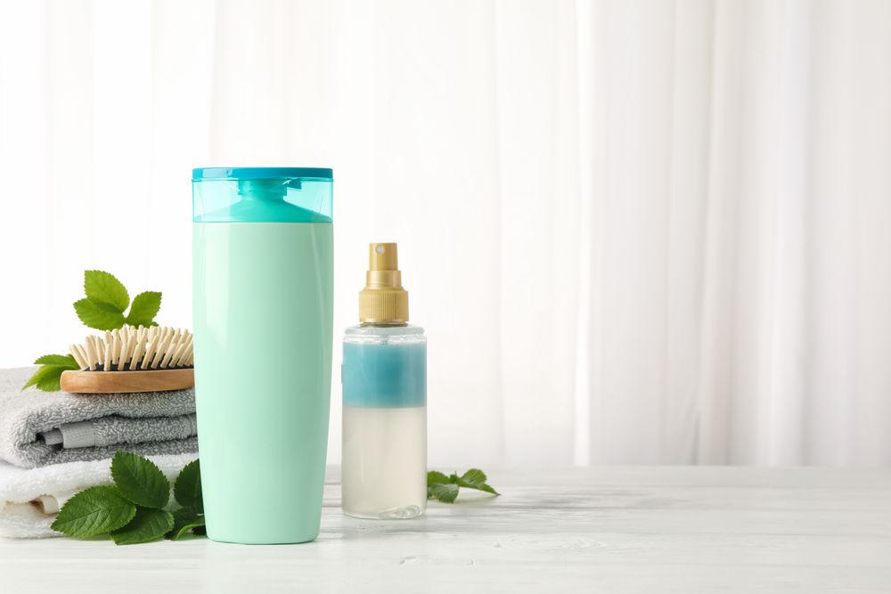 Composition with hair care products on wood table