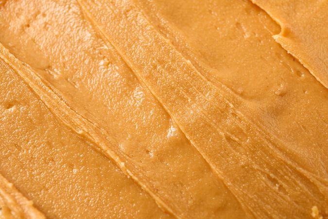 Peanut butter as background, space for text and closeup