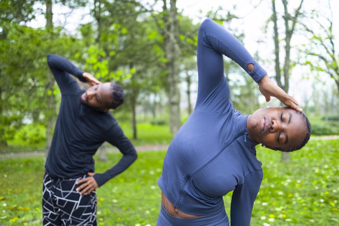 Black couple exercise during the beautiful spring morning.