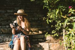 Woman with photo camera on street