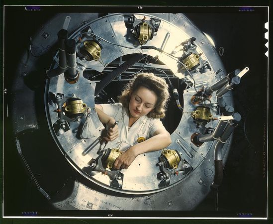 Inglewood, CA, USA - 1942: Woman working on B-52 engine
