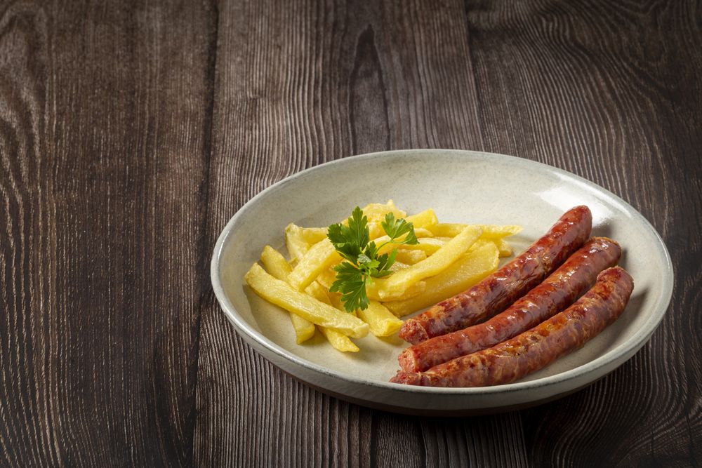 Grilled German sausage with french fries.