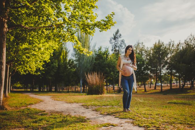 Pregnant female walking in park