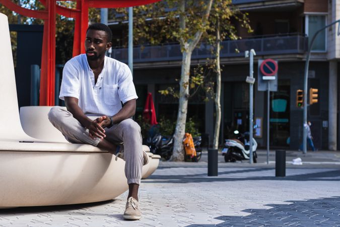 Stylish Black man in city street