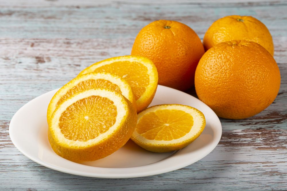 Sliced oranges on the table.